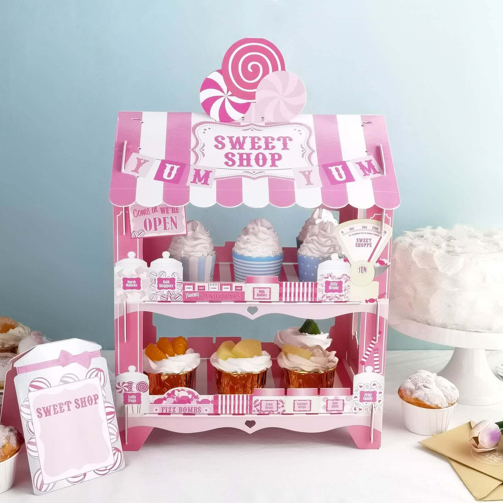 2-Tier Cardboard Cupcake Stand with White/Pink Sweet Shop Design - Colorful Candy Themed Dessert Cart Display for Pastries & Treats 18"