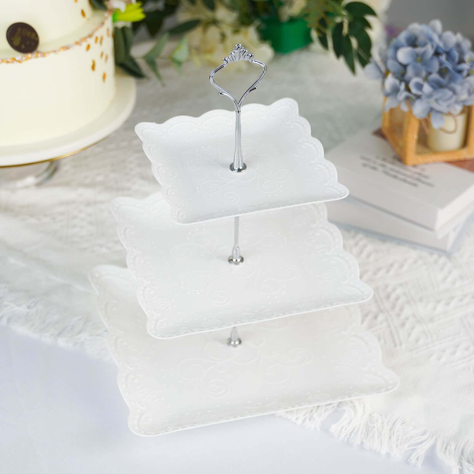3-Tier Plastic Square Cupcake Stand Tower White - Charming Easy to Assemble Dessert Display Serving Tray Platter with Floral Embossed Scalloped Rim & Silver Handle for Tea Parties Weddings & Special Occasions 13"