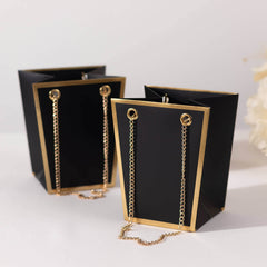 6 Pack Black Gold Edge Paper Flower Gift Bags With Metal Chain Handles, Trapezoid Party Favor Tote Bags - 5"x6"