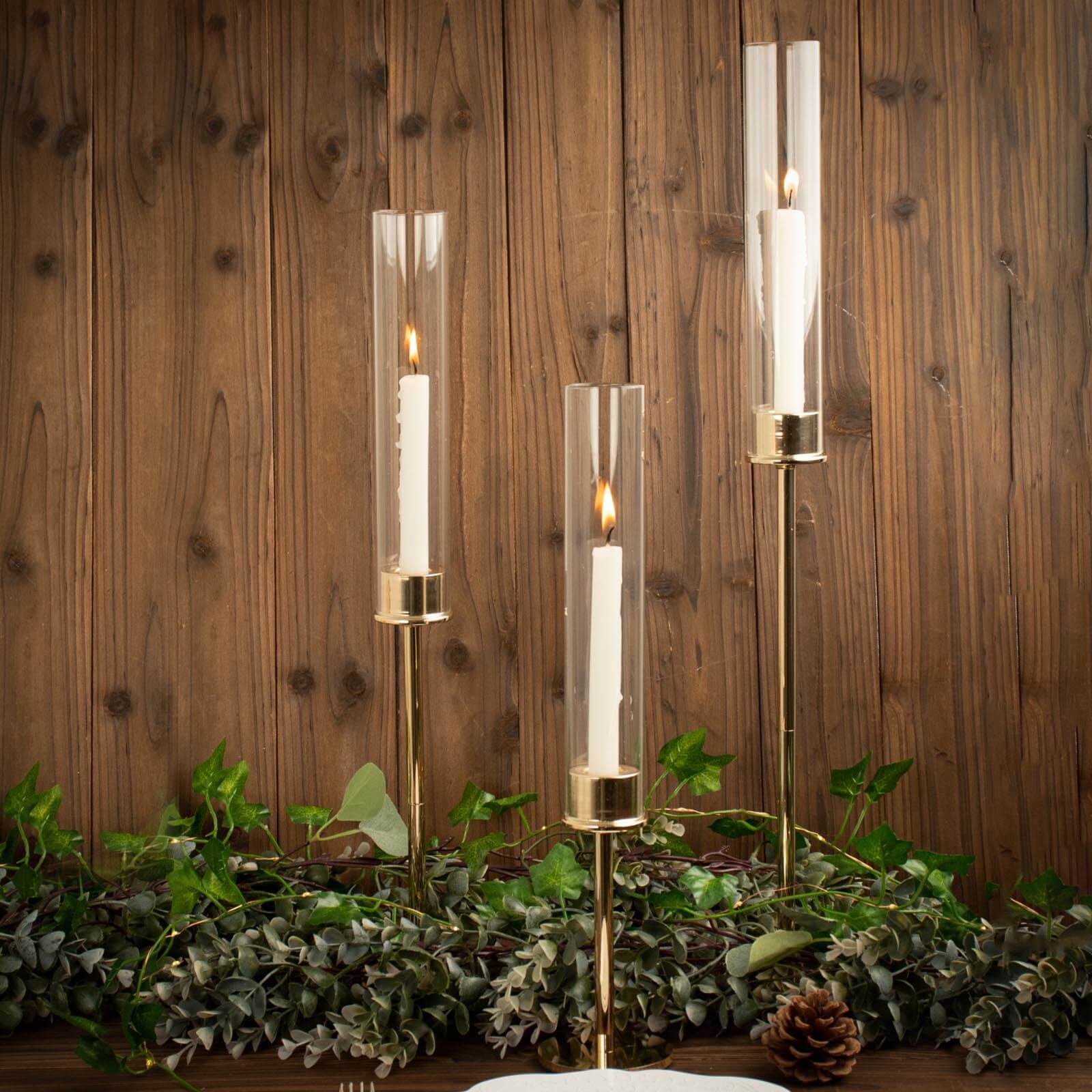 Set of 3 Tall Gold Metal Taper Candlestick Holders, Clear Glass Hurricane Candle Stands With Chimney Candle Shades 16", 20", 24"