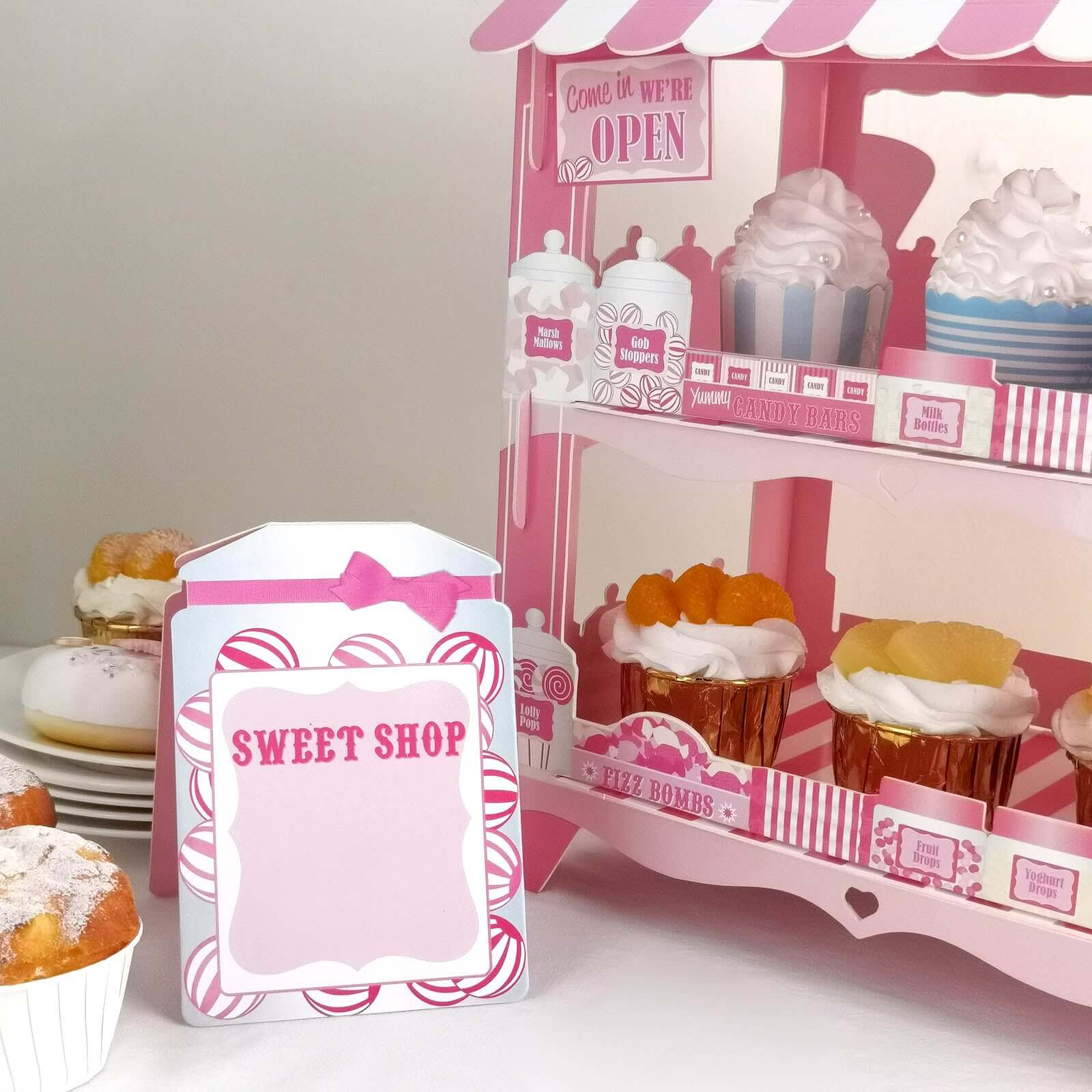 2-Tier Cardboard Cupcake Stand with White/Pink Sweet Shop Design - Colorful Candy Themed Dessert Cart Display for Pastries & Treats 18"