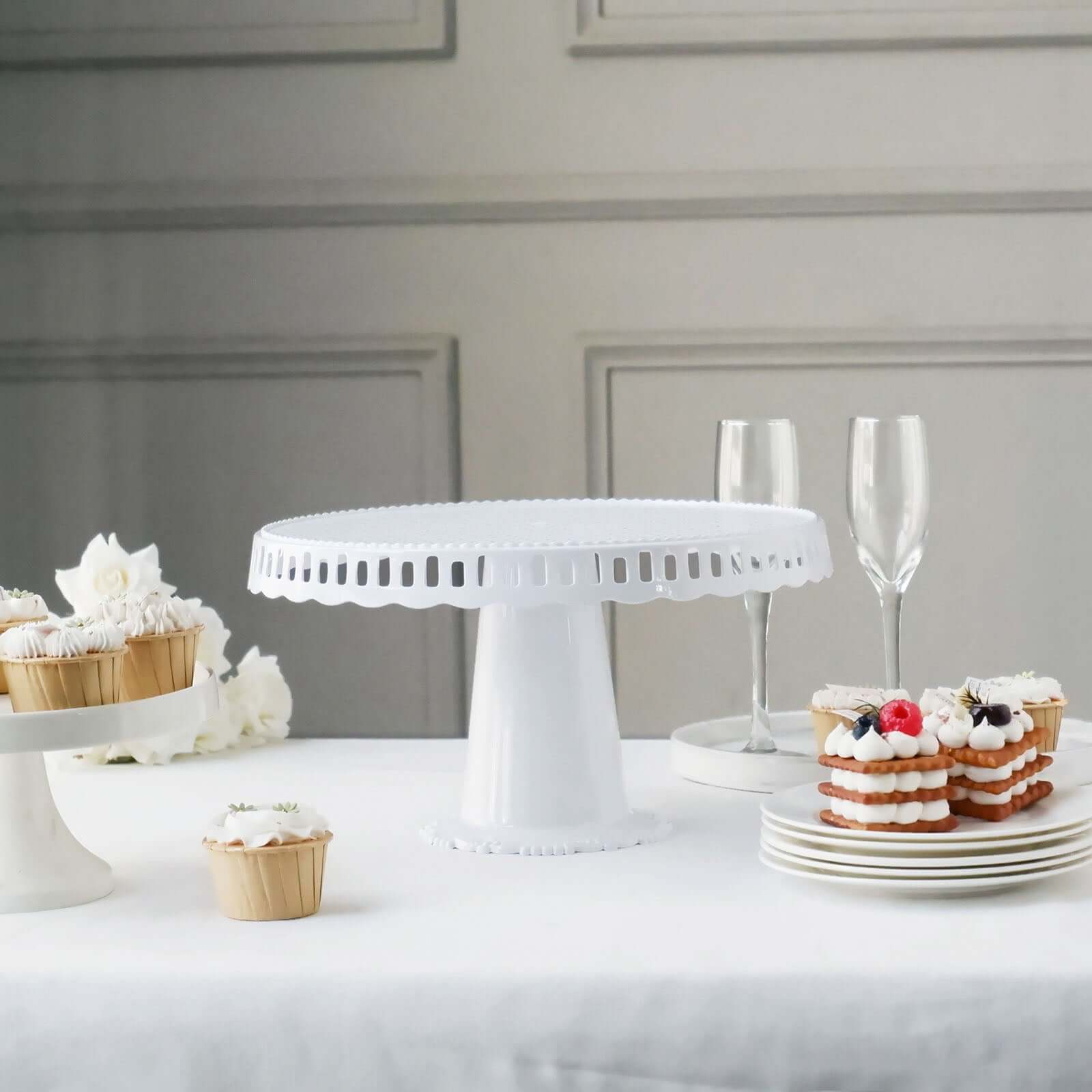 4-Pack Plastic Round Pedestal Cake Stands White - Reusable Cupcake Pastry Display Risers with Hollow Ribbon Trim Edges for Stylish Dessert Presentation 13"