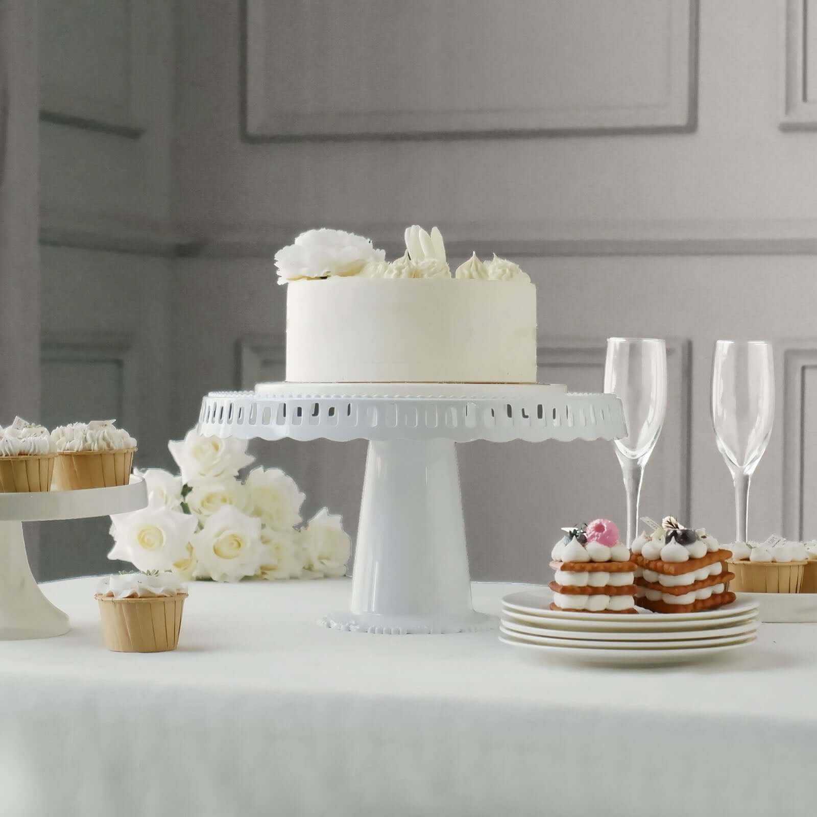 4-Pack Plastic Round Pedestal Cake Stands White - Reusable Cupcake Pastry Display Risers with Hollow Ribbon Trim Edges for Stylish Dessert Presentation 13"