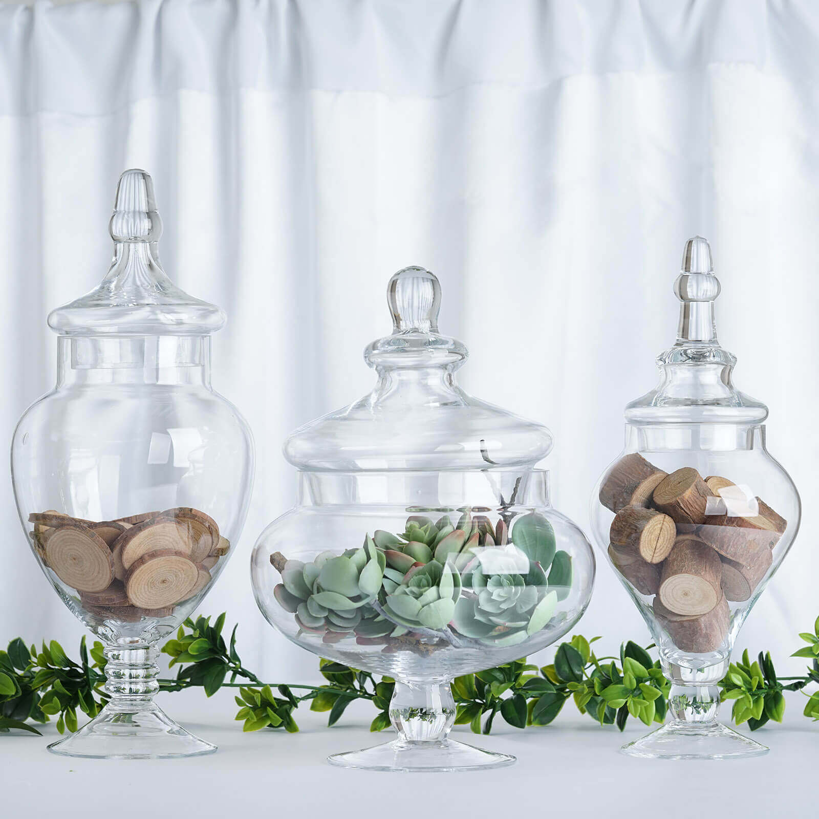 Set of 3 Glass Candy Jars Pedestal Apothecary Design Clear with Snap-On Lids - Stylish Party Favor Containers 10"/12"/14"