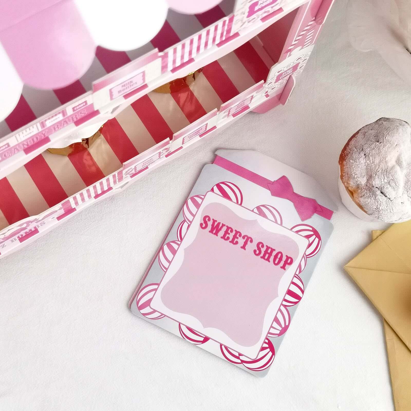 2-Tier Cardboard Cupcake Stand with White/Pink Sweet Shop Design - Colorful Candy Themed Dessert Cart Display for Pastries & Treats 18"